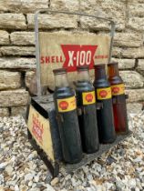 A Shell X-100 Motor Oil double sided oil bottle crate, with five matching Shell pint bottles and two