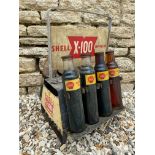 A Shell X-100 Motor Oil double sided oil bottle crate, with five matching Shell pint bottles and two