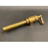 A bronze petrol pump trigger nozzle.