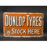 An early Dunlop Tyres in Stock Here rectangular double sided enamel sign lacking hanging flange,