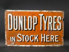 An early Dunlop Tyres in Stock Here rectangular double sided enamel sign lacking hanging flange,