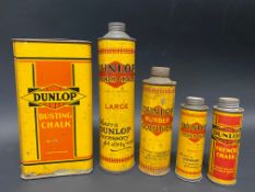 Four Dunlop cylindrical tins and a Dunlop Dusting Chalk tin.