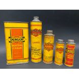 Four Dunlop cylindrical tins and a Dunlop Dusting Chalk tin.