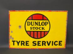 A Dunlop Stock Tyre Service rectangular enamel sign, with good gloss, 30 x 20".