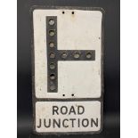 A metal road sign for Road Junction, with integral reflective discs, 12 x 21".