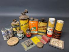 A group of small oil cans and other tins including Raleigh.