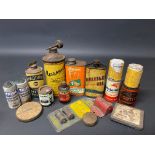 A group of small oil cans and other tins including Raleigh.