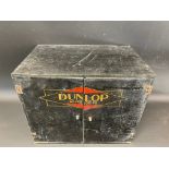 A Dunlop counter top two door dispensing cabinet with advertising to the front and inside, also