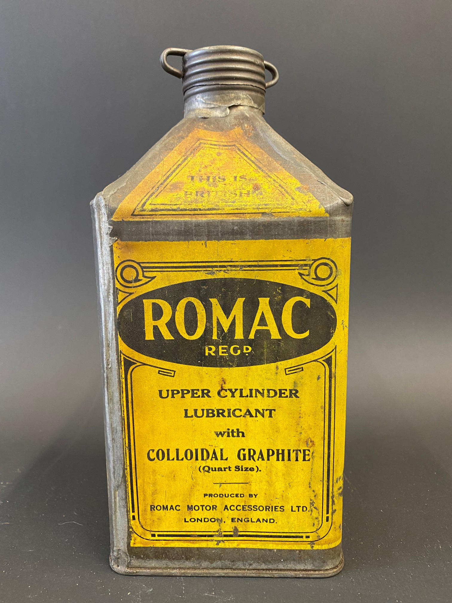 A Romac Upper Cylinder Lubricant pyramid can.
