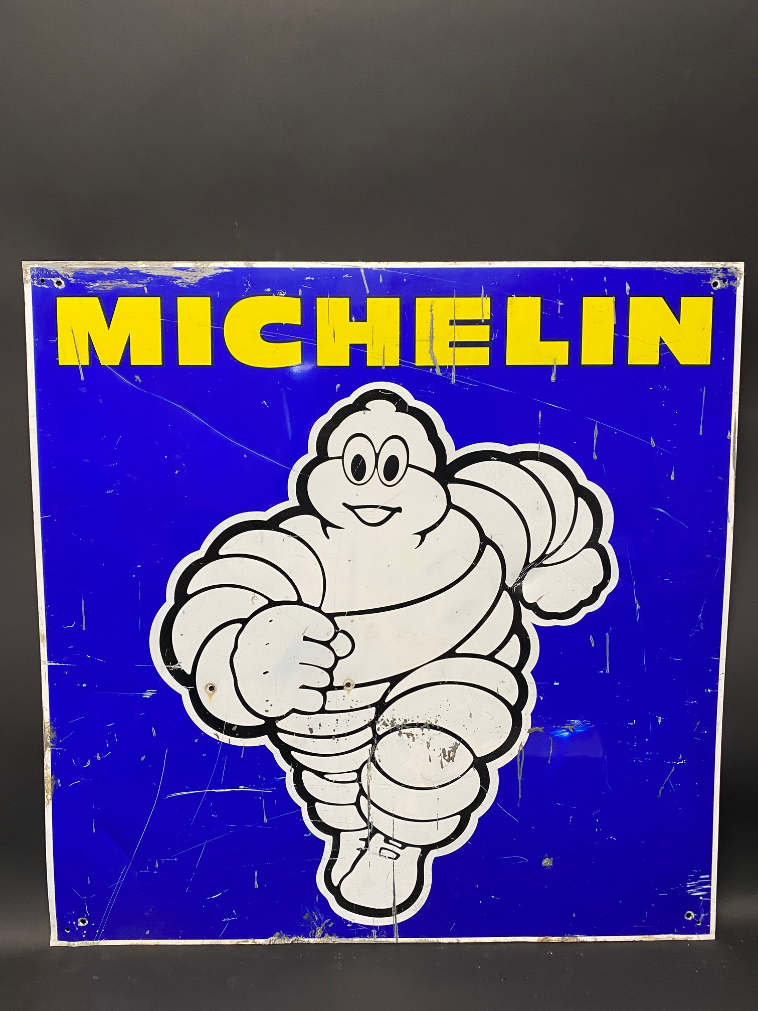 A contemporary Michelin pictorial tin advertising sign, 29 1/2 x 29 1/2".