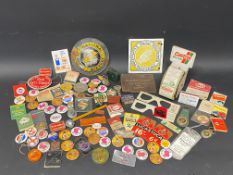 A quantity of garage related promotional badges, keyrings, books of matches etc.