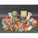 A quantity of garage related promotional badges, keyrings, books of matches etc.