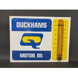 A Duckhams Motor Oil enamel thermometer by Burnham, in good condition, 26 x 20".