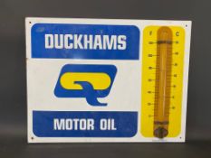 A Duckhams Motor Oil enamel thermometer by Burnham, in good condition, 26 x 20".