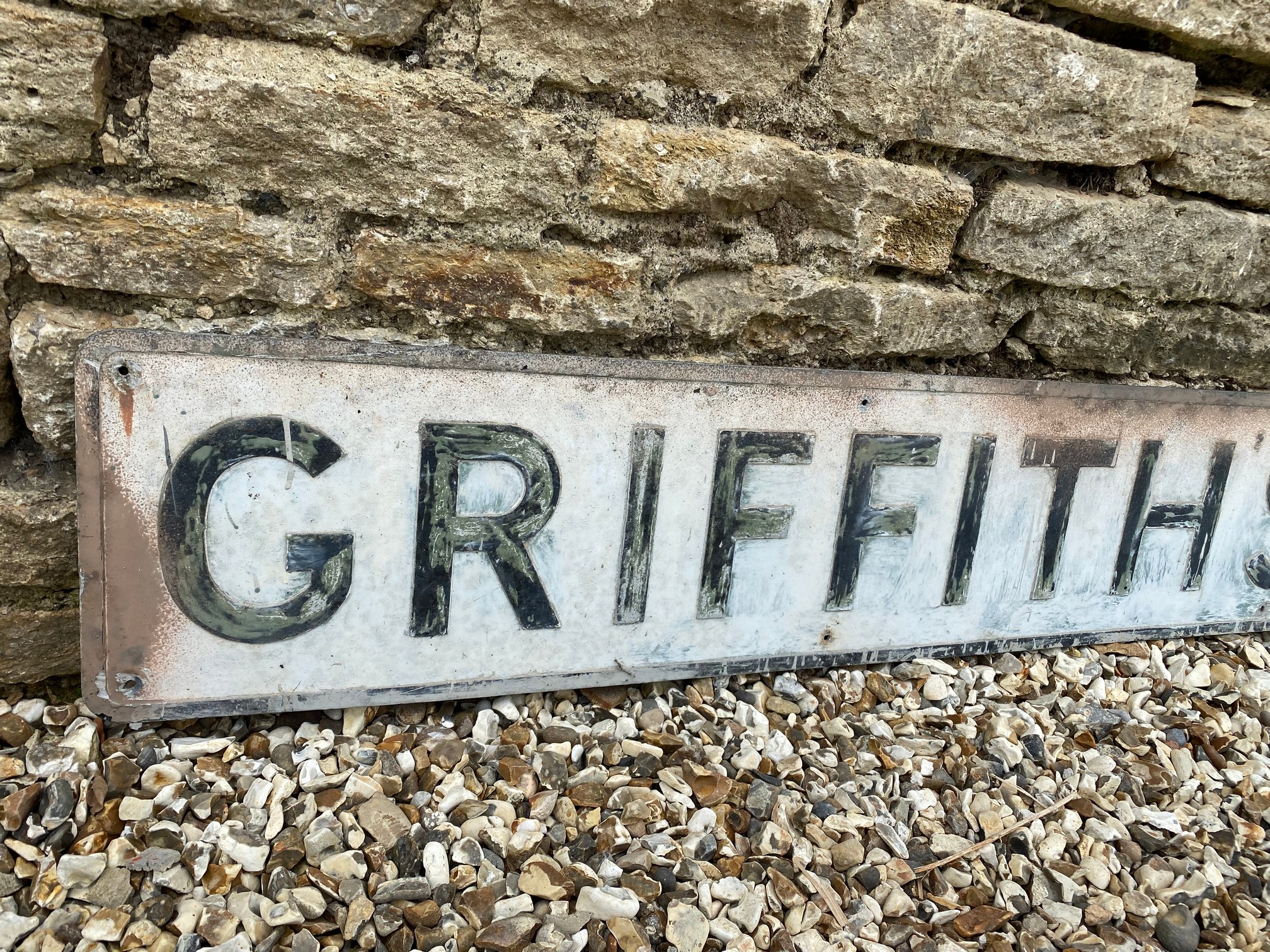 A rectangular metal sign advertising Griffith's Garage, 84 x 10". - Image 2 of 4