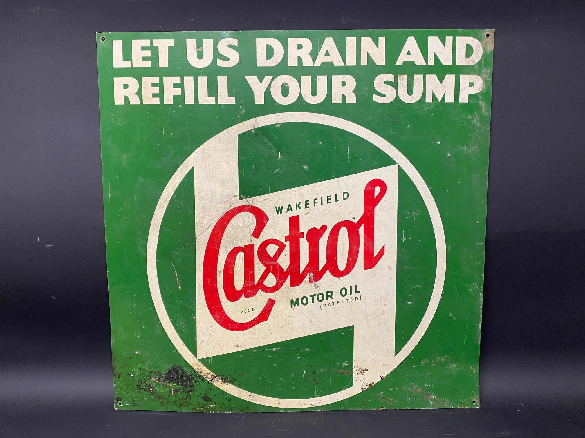 A Wakefield Castrol Motor Oil 'Let us drain and refill your sump' tin advertising sign by Cowling,