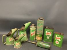 A quantity of Castrol oil cans and measures.