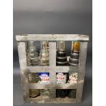 An Essolube eight division oil bottle crate containing three quart Esso Extra bottles, three quart