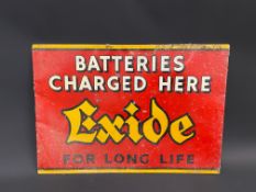 An Exide Batteries Charged Here rectangular tin advertising sign, 24 1/2 x 17".