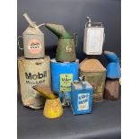 A selection of assorted cans including Esso Blue, Castrol etc.