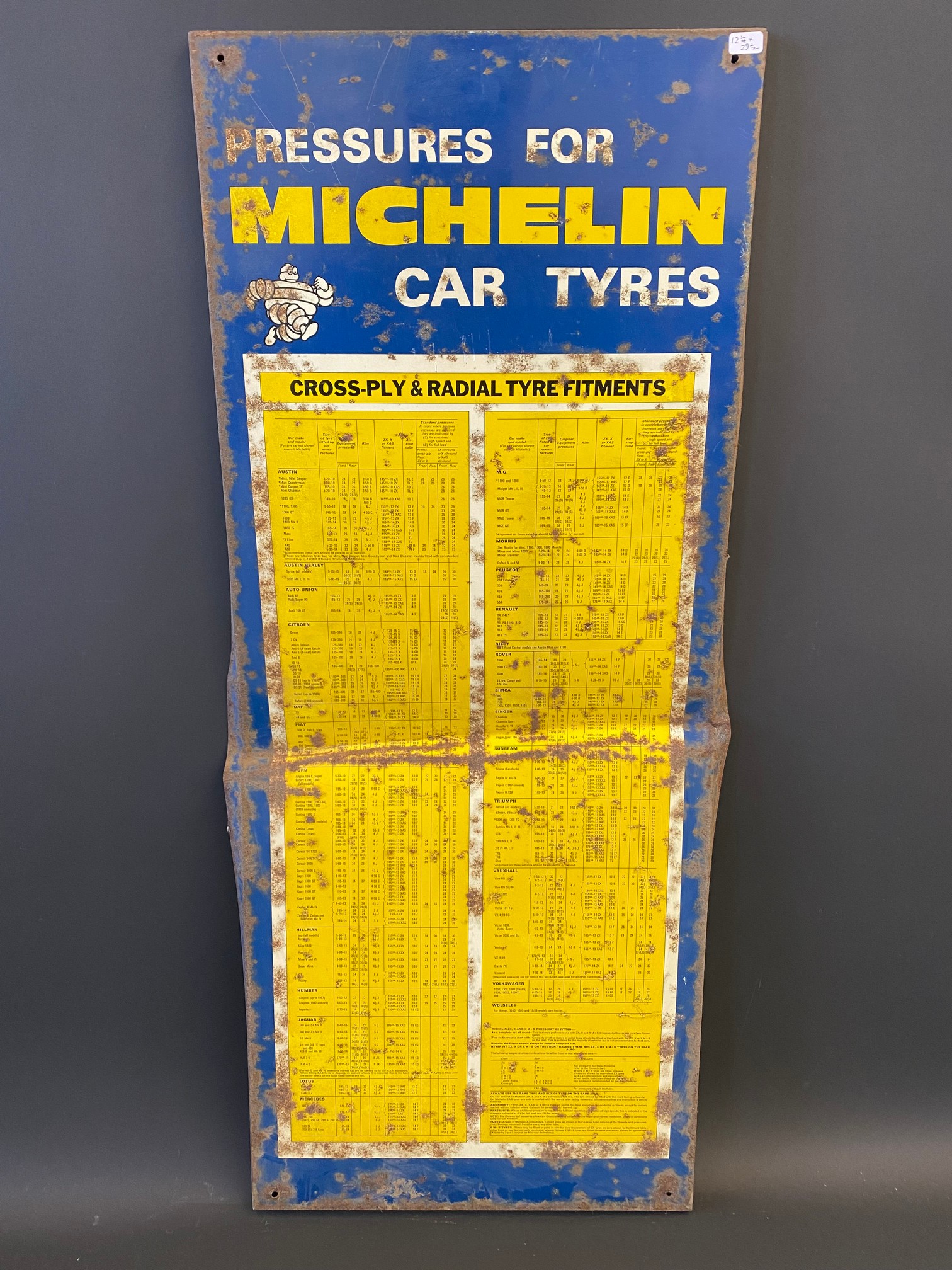 A Michelin Car Tyres tin tyre pressure chart sign, 12 1/4 x 29 1/2".