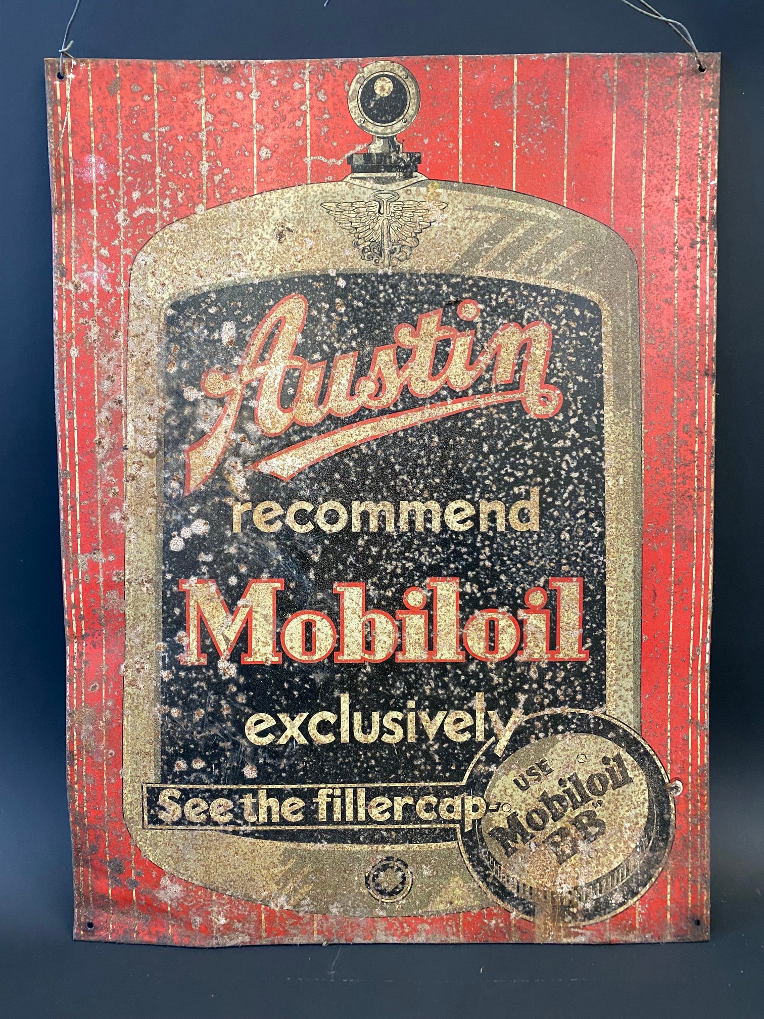 An 'Austin recommend Mobiloil' rectangular tin advertising sign, with radiator image filling the