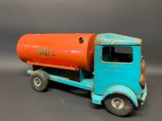 A Tri-ang tinplate model of a petrol tanker in Shell livery.