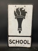 A metal road sign for School, with early torch image, 12 x 21