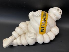 A Michelin Mr Bibendum air pump advertising figure.