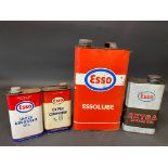 Four assorted Esso oil cans.