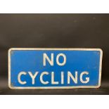 A No Cycling metal road sign, 22 3/4 x 10".