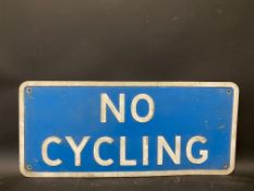 A No Cycling metal road sign, 22 3/4 x 10".