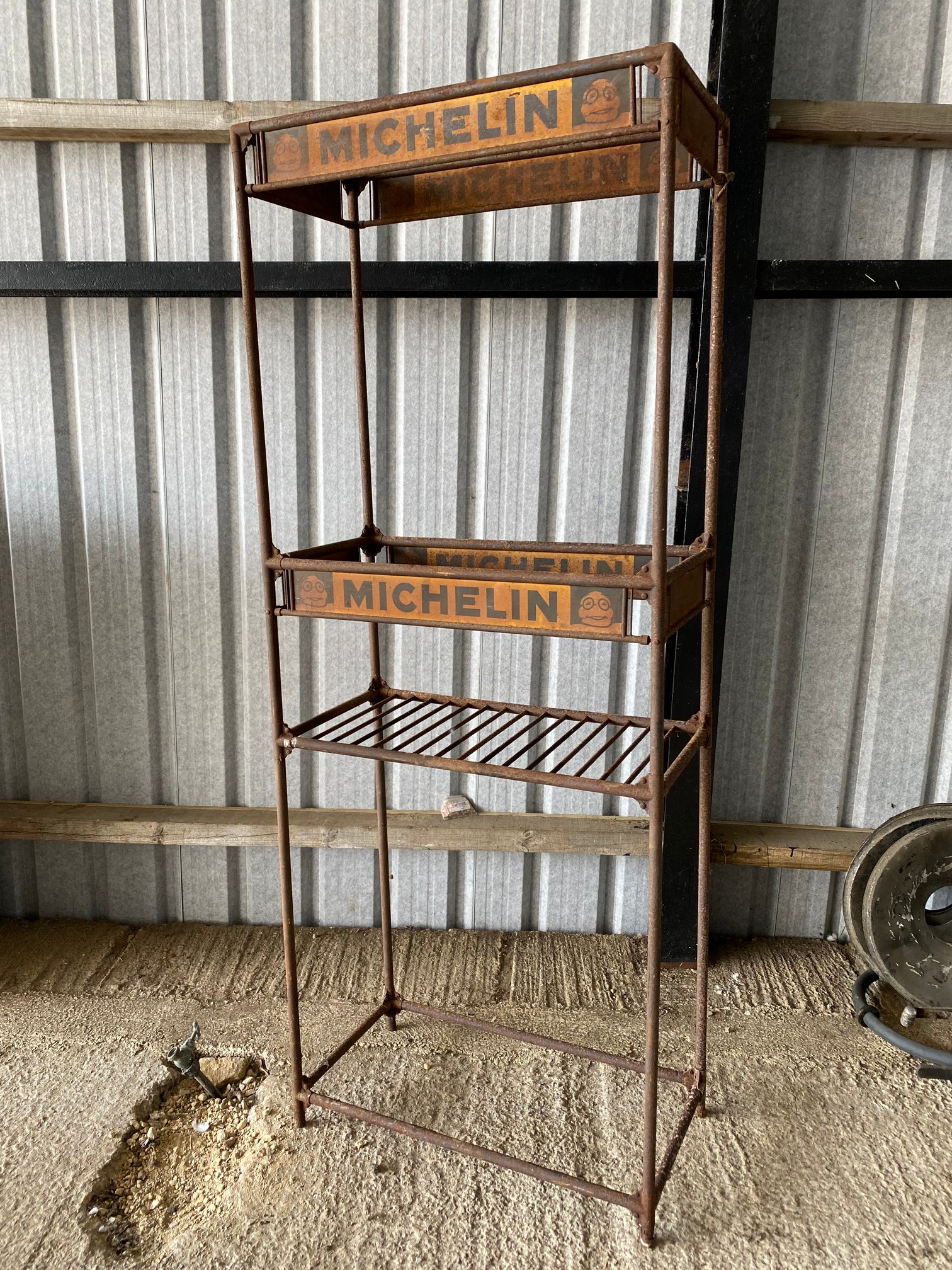 A large Michelin garage tyre rack with advertising all round, 35 1/2" w x 90 1/2" h x 18" d.