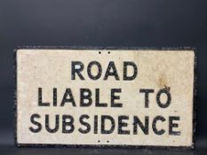 A large road sign Road Liable To Subsidence, with integral glass reflectors, 30 x 16 3/4".