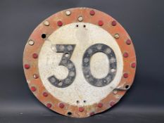 A 30 mph circular road sign with integral reflective discs, 24" diameter.