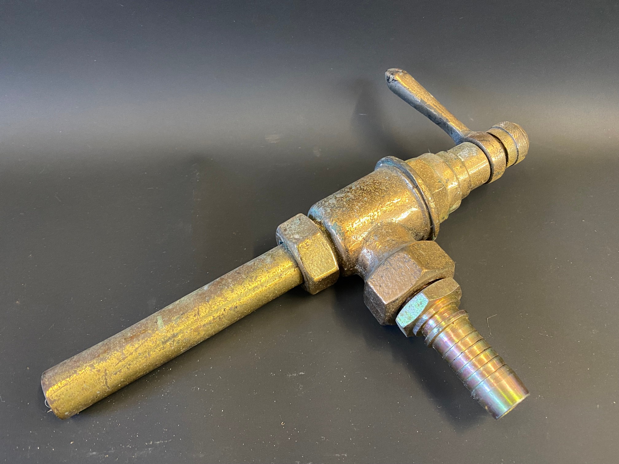 A bronze petrol pump trigger/nozzle.