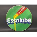 An Essolube circular double sided enamel sign with image of oil pouring from a bottle, 26"