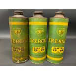 Three BP Energol cylindrical quart cardboard oil cans.