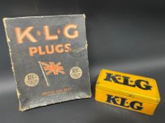 A KLG spark plug tin plus a KLG Plugs cardboard dispensing box.