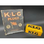 A KLG spark plug tin plus a KLG Plugs cardboard dispensing box.