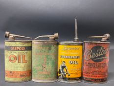 Four oval lubricating oil cans including Superior and Bestoil.
