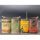 Four oval lubricating oil cans including Superior and Bestoil.