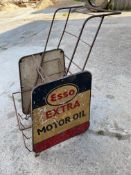 An Esso Extra garage forecourt oil bottle trolley, with an aluminium advertising sign to each side.