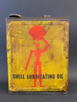 A Shell Lubricating Oil rectangular gallon can with robot/stick man motifs.