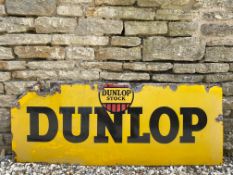 A Dunlop Stock rectangular enamel sign, 54 1/4 x 21".