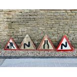 Four triangular road signs.