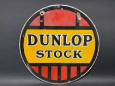 A Dunlop Stock circular double sided enamel sign, 18" diameter.