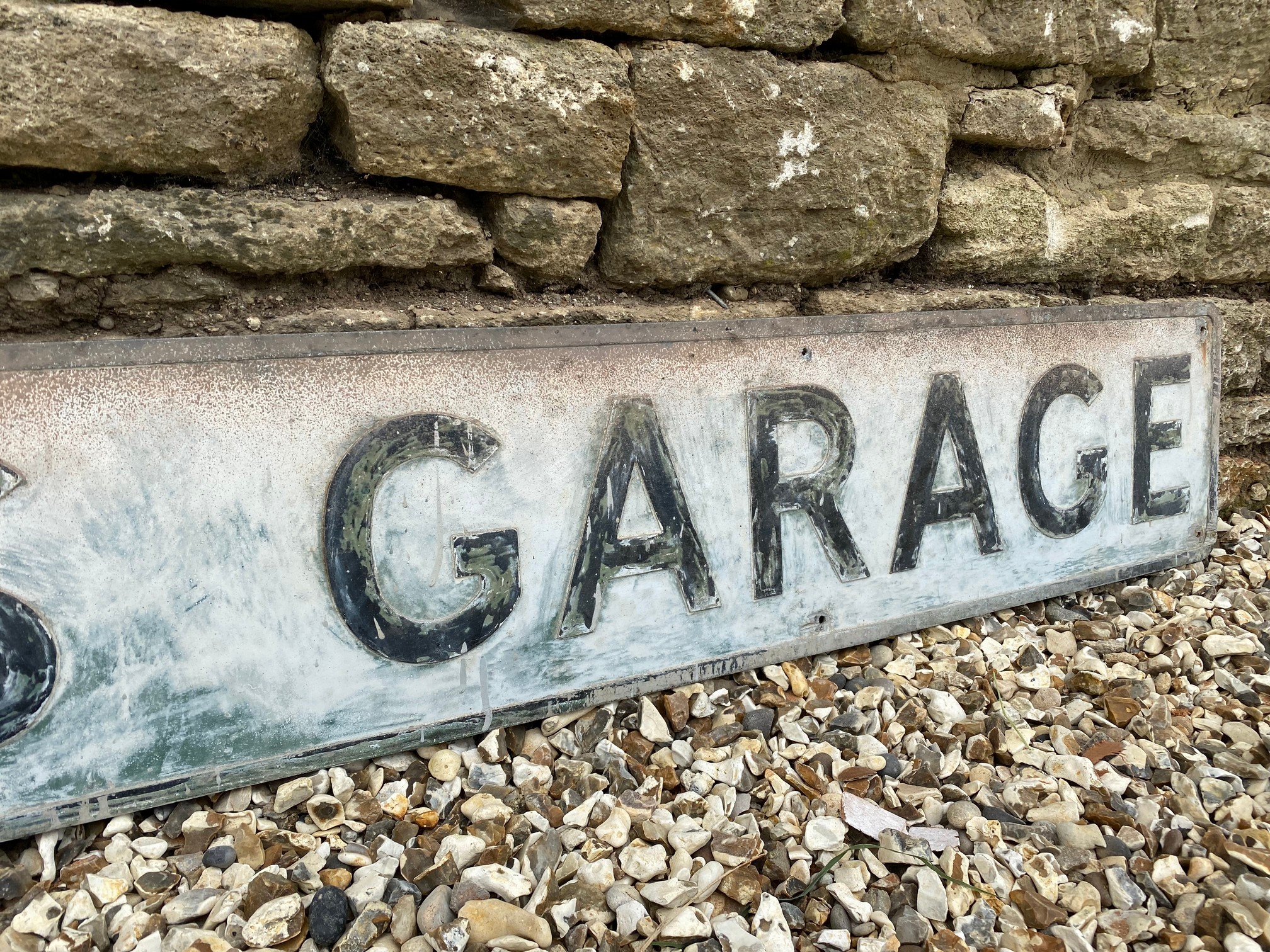 A rectangular metal sign advertising Griffith's Garage, 84 x 10". - Image 3 of 4