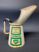 A BP Energol Universal Tractor Oil quart measure in good condition.