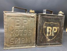 Two early versions of a BP two gallon petrol can, one with shield shaped transfer.